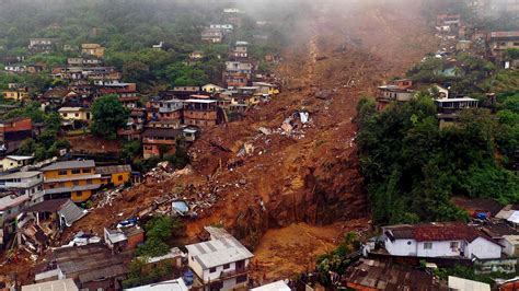 apocalyptic floods and huge mudslides kill at least 120 people after 10 inches of rain falls in