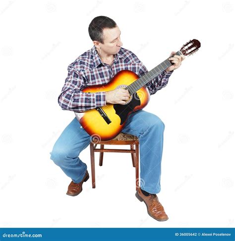 Adult Man Plays A Guitar Sitting On An Chair Stock Photo Image Of