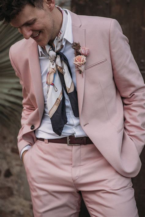 Groom In Blush Pink Wedding Suit With Neck Tie Two Grooms In Pink Wedding Suit And Green