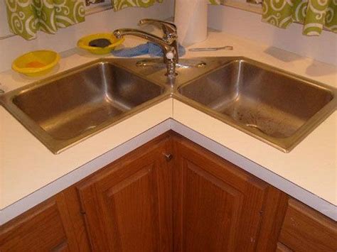 Put it in the corner help save space too. Corner kitchen sink cabinet design | Corner sink kitchen ...