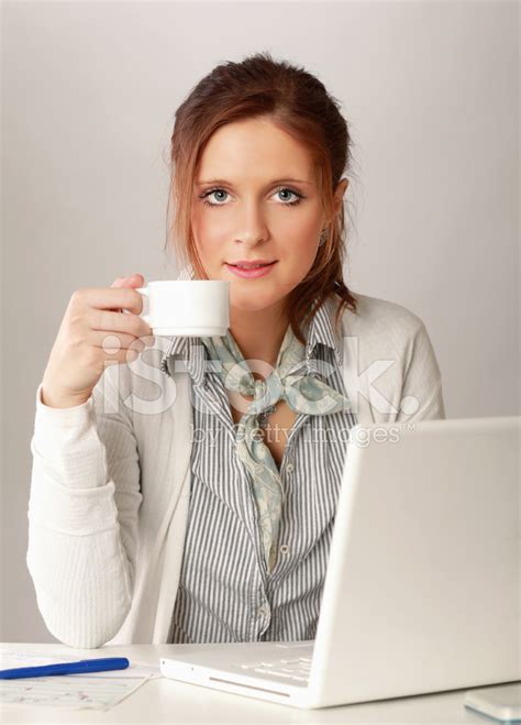 Young Woman Holding A Cup Of Coffee Stock Photo Royalty Free Freeimages