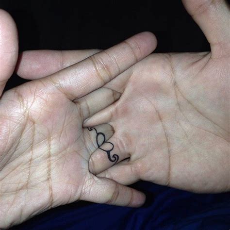 This video contains collection of 80 wedding ring tattoo ideas and designs. 40+ Sweet & Meaningful Wedding Ring Tattoos
