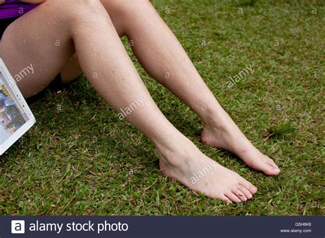Girls Hairy Legs On Grass Stock Photo Alamy