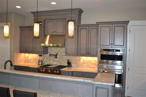 This classic kitchen by cabinets.com designer sheila pairs our light gray stain with unique and aged finishes for a decidedly rustic feel. Gray Stained Cabinets, With Black Glaze - Traditional ...