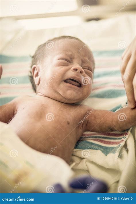 Crying Newborn Infant Baby Boy In A Hospital Bed Stock Photo Image Of