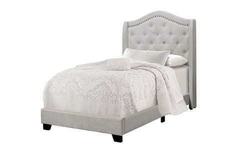 A white and gold block print headboard is accented with gray curtains lined with stunning ivory trim and hanging over a twin bed. Light Grey Velvet Upholstered Twin Bed with Nailhead at ...