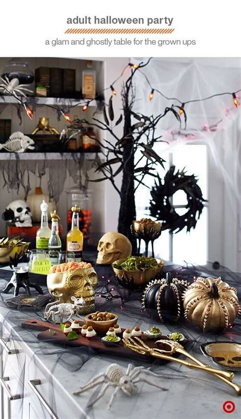 A Table Topped With Lots Of Halloween Food And Decorations On Top Of