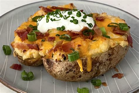 Loaded Baked Potato Recipe With Lots Of Cheese Bacon The Kitchn