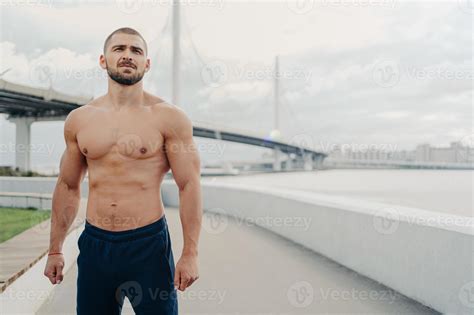 Handsome Muscular Man With Naked Torso Has Outdoor Fitness Workout