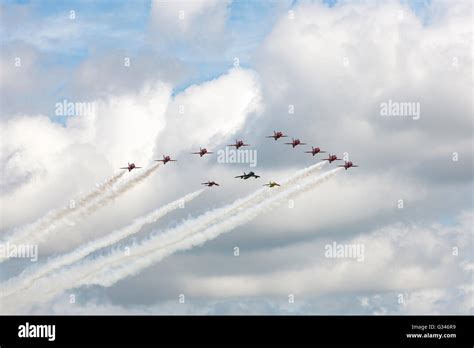 Royal Air Force Red Arrows Display Team In Formation With A Hawker