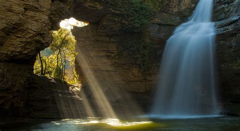 Limestone Cave And Waterfall The Foradada Green Trees And