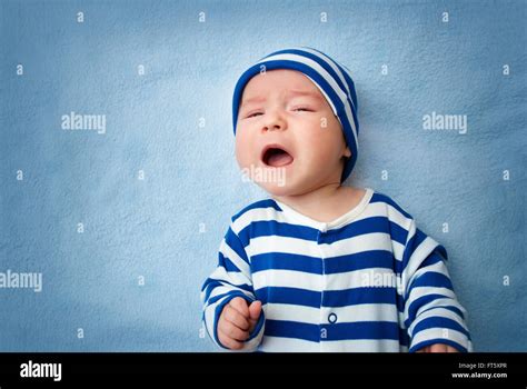 Baby Crying In Bed Stock Photo Alamy