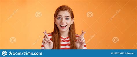excited hopeful redhead girl hope win lottery smiling optimistic look faith believe dream