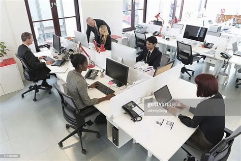 Busy Modern Office With People Working At Desks High Res Stock Photo