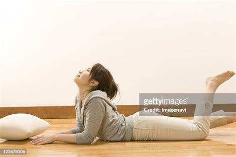 Woman Lying On Stomach With Feet Up Bildbanksfoton Och Bilder Getty