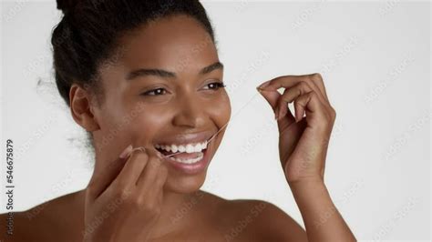 Deep Oral Hygiene Happy African American Woman Flossing Teeth With