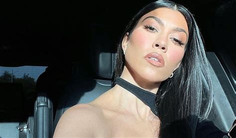 Kourtney Kardashian Strikes A Sultry Pose In Cut Out Midi Dress Celebrity Insider