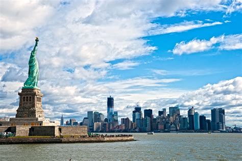 The Statue Of Liberty And Manhattan Skyline New York City Ny Sky Dancing