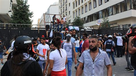 Security Forces Tear Gas Anti Govt Protesters On Centennial Beirut Explosion News Al Jazeera