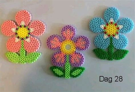 Here are the completed projects: Easy flowers | Perler bead patterns, Pyssla beads design ...