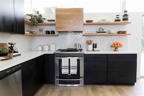 The wood floor is made up of very light wood and there are notice how only the lower cabinets are red and the uppers are light gray. Kitchens With Black Cabinets