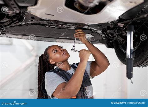 African Female Auto Mechanic Work In Garage Car Service Technician