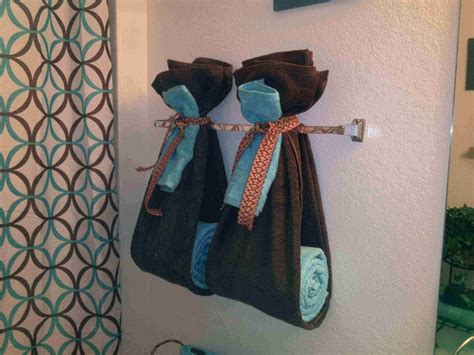 I've previously posted about our bathroom hanging towels using a washcloth and ribbon. Exclusive DIY Bathroom Towel Decoration Ideas - Live Enhanced