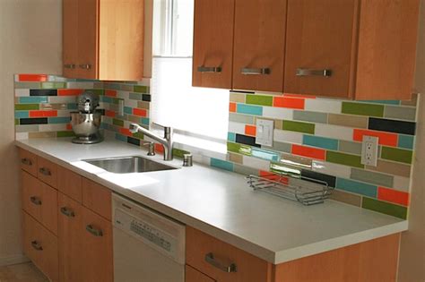 A glass backsplash positioned across from a window will reflect natural light, plus it doesn't mold or. Colorful Backsplash Tiles for Kitchens - HomesFeed