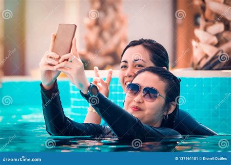 Friends Swimming And Taking A Selfie On The Pool Stock Image Image Of Party People 137961181