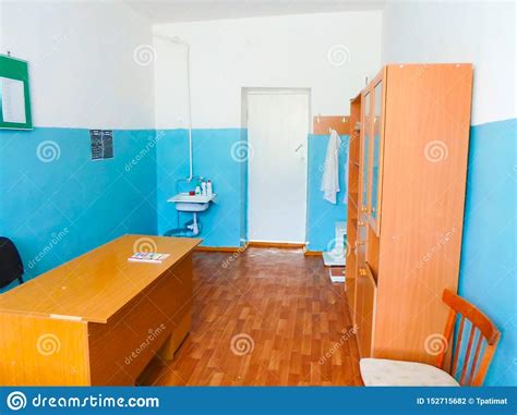 Medical Room At School With A Cupboard Table And Wash Basin Blue And