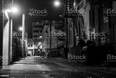 Dark Icy Alleyway At Night In Black And White Stock Photo Download
