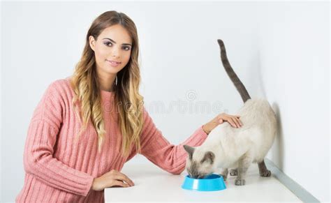 Gorgeous Brunette With Her Cat Stock Photo Image Of Feed Girl