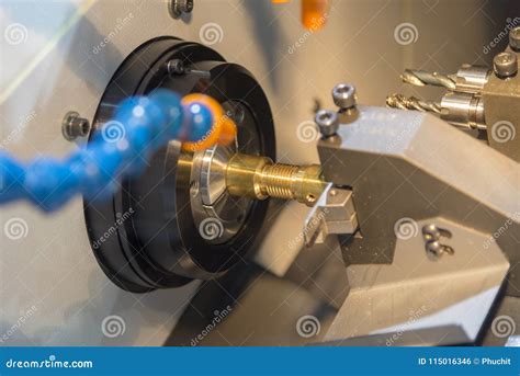 The Cnc Lathe Machine Cutting The Brass Shaft Stock Photo Image Of
