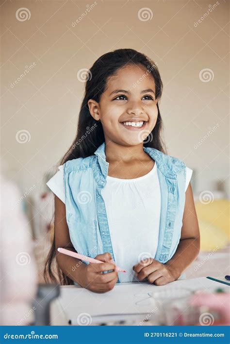 Shes In Her Creative Element A Cute Young Girl Drawing On Paper At