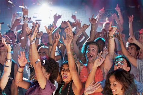Enthusiastic Crowd Cheering At Concert Stock Photo Dissolve