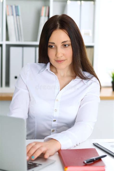 Young Beautiful Business Woman Or Confident Female Accountant In Office