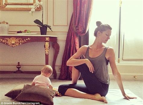 Gisele Practises Yoga Poses With Infant Daughter Vivian By Her Side