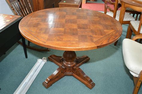 Sustainably sourced in home fair trade. 40" round oak center pedestal coffee table with parquet ...