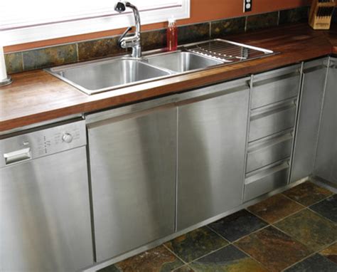 Gain insight on stainless steel kitchen cabinets, an alternative material used in modern kitchen design. Butcher-block top on stainless steel cabinets