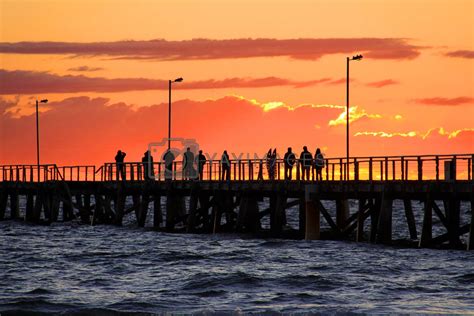 People On Jetty Watching Sunset Semaphore Beach Adelaide Aus By