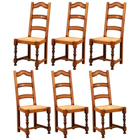 Early 20th Century French Carved Oak Dining Chairs With Vine Motifs