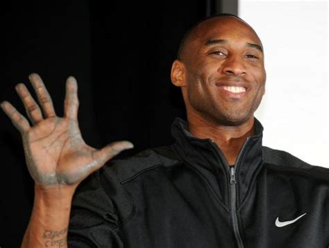 Kobe Bryant Smiles And Shows His Right Hand With Cement 1 Comment