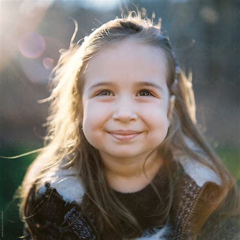 Close Up Portrait Of A Beautiful Young Girl With Big Cheeks By