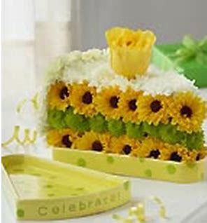 Cake and flowers for birthday. Cake slide fresh flowers for birthday with yellow and ...