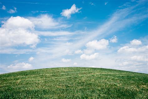 Green Grass Field Under White Clouds · Free Stock Photo