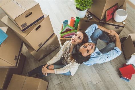 Young Couple Moving In Into New Apartment Stock Photo Image Of