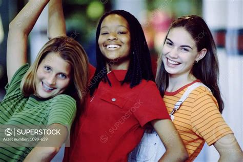 Portrait Of Three Teenage Girls Smiling Superstock