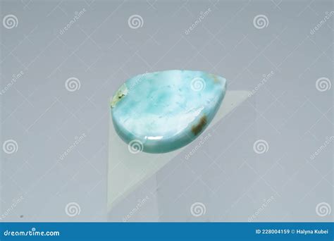 Natural Larimar Stone On A Stand On A White Background Stock Image