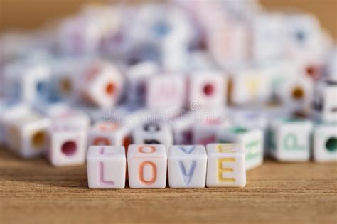 Love Written In Letter Beads On Wood Background Stock Photo Image Of