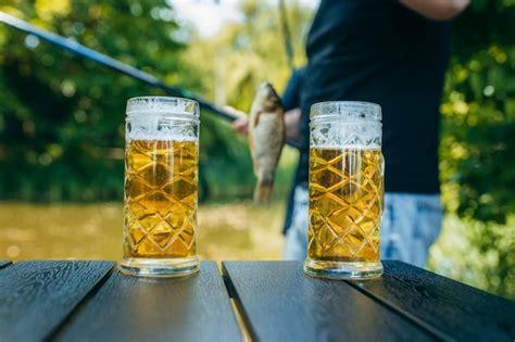Premium Photo Adult Man Catching Fish And Drinking Beer